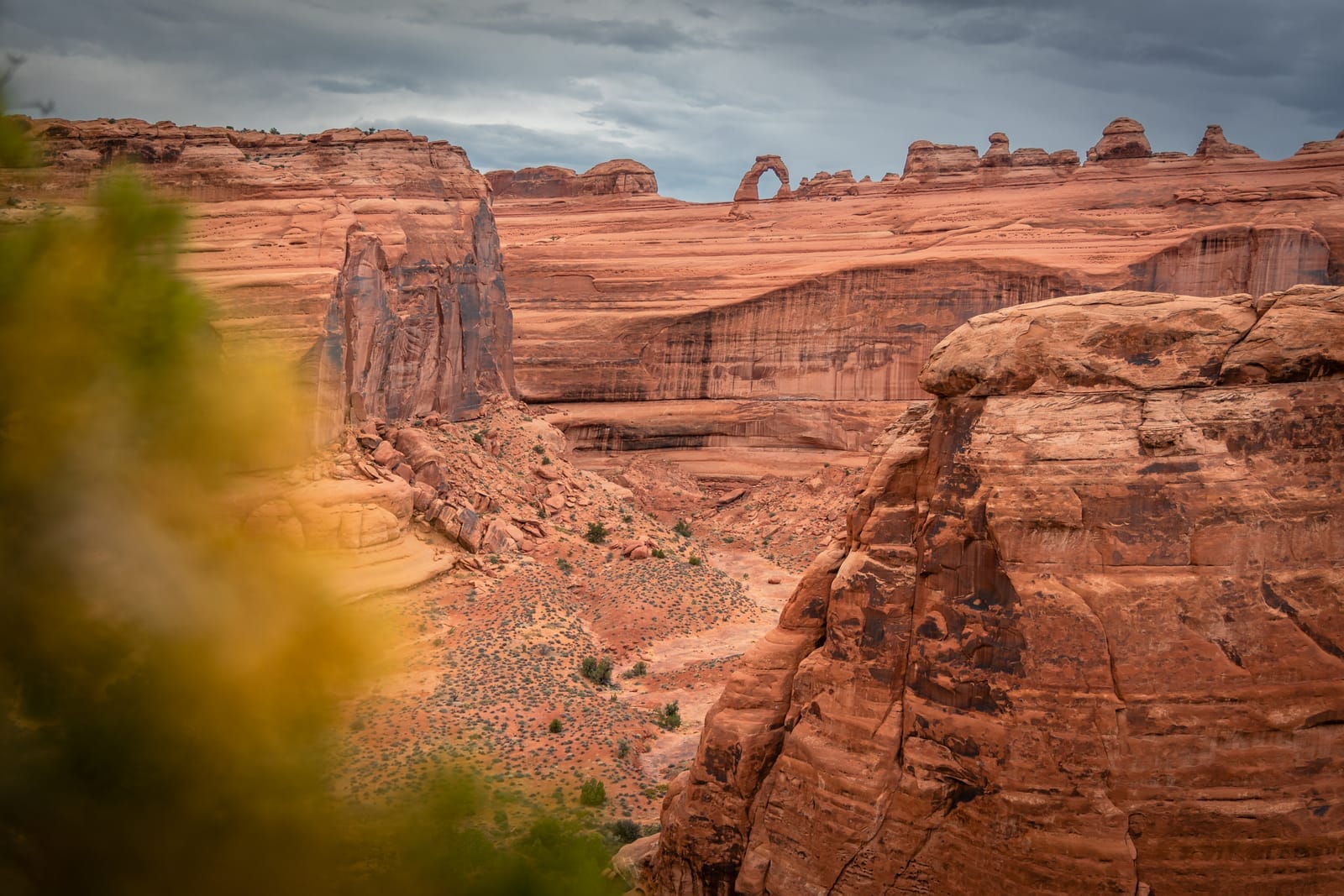 Delicate Arch reveals itself, tiny in the distance but far from the crowds